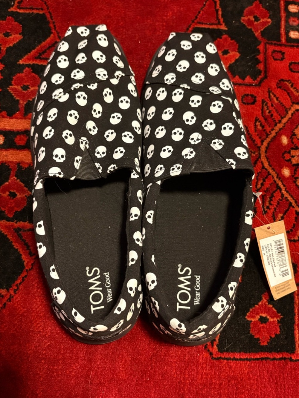 Men’s TOMS Black Canvas Slip-Ons with White Skull Print